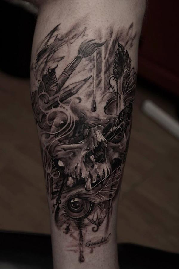  67- skull tattoo on his leg 