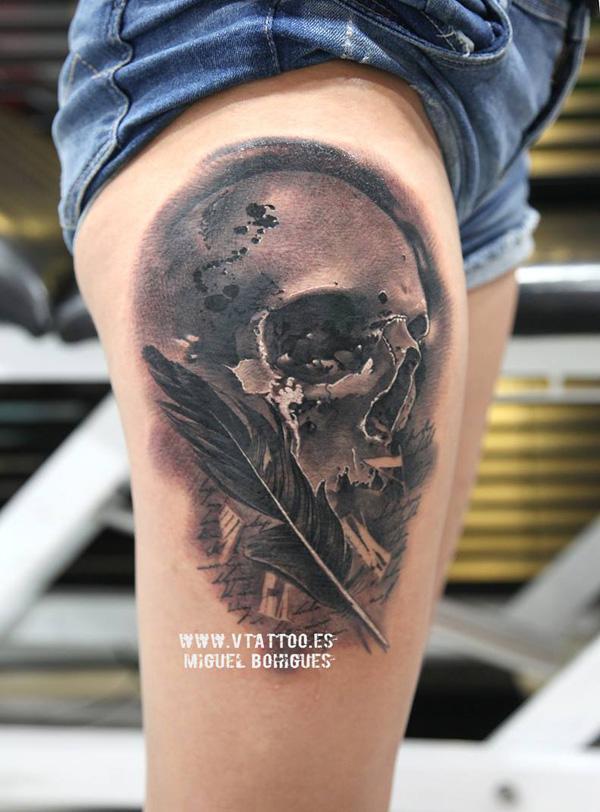  69 Skull with feathers tattoo on thigh 