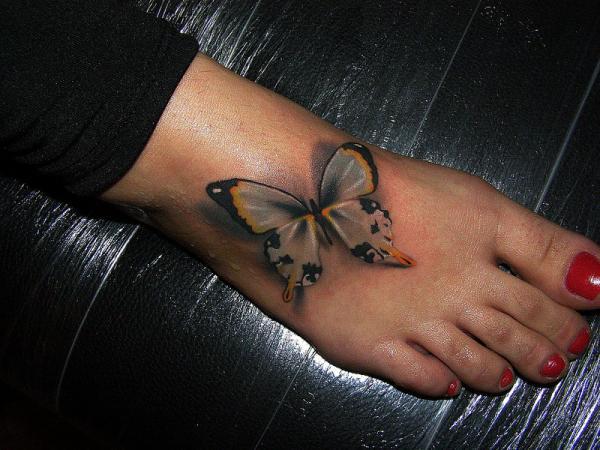 Tribal Butterfly Tattoo On Foot