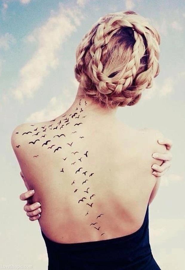 Small Bird Tattoo On Neck