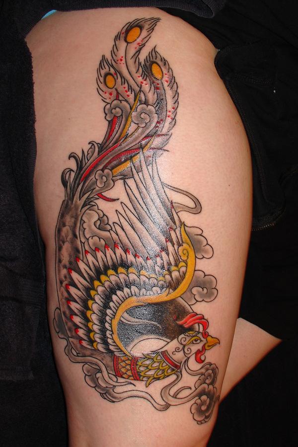 28 Phoenix tattoo on thigh