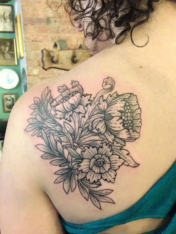 Flower tattoo on back shoulder