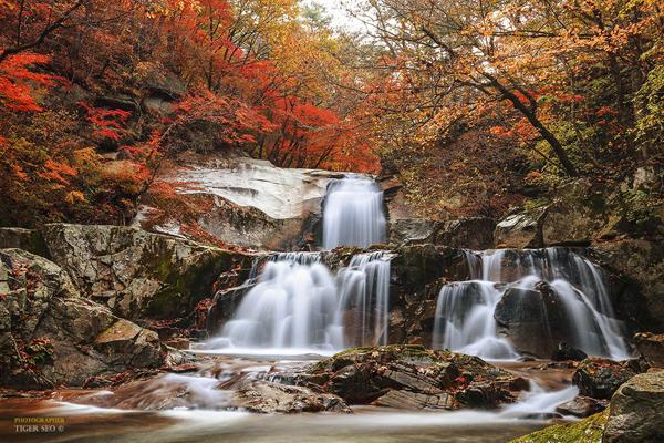 waterfall in Autumn by Tiger Seo
