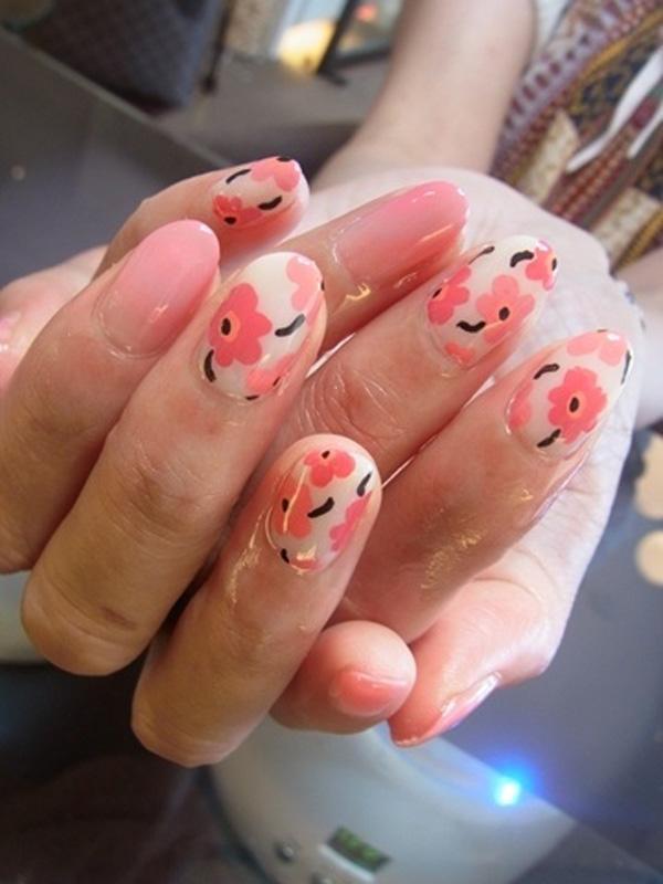 This very cute and homey nail art design is something that you can recreate on your own nails and keep on for many days. It can go well with any occasion you go to and it can also be easily reapplied. The simple flower shapes and plain colors make this popular nail art a favorite for many.