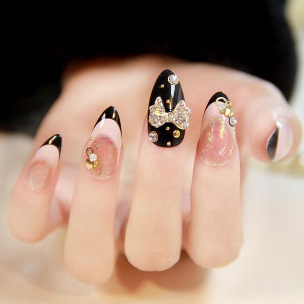 When they talk about nails with attitude, this is probably the epitome of such. Sleek in black and baby pink, this sweet and rather dangerous nail art has a great combination of contrasting colors. From the sharp black blended into the lightest pink and topped with golden and silver beads, this nail art simply rocks.