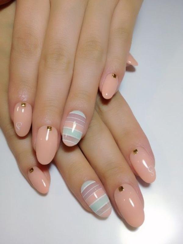 Cute and simple. The baby colors look amazing and clean on this piece of nail art. Great for pajama parties or simply hanging out with your girlfriends. The little gold beads on top add a bit of mature attitude into the nails nevertheless it succeeds in giving the impression that you’re pretty, cute and at the same time ladylike.