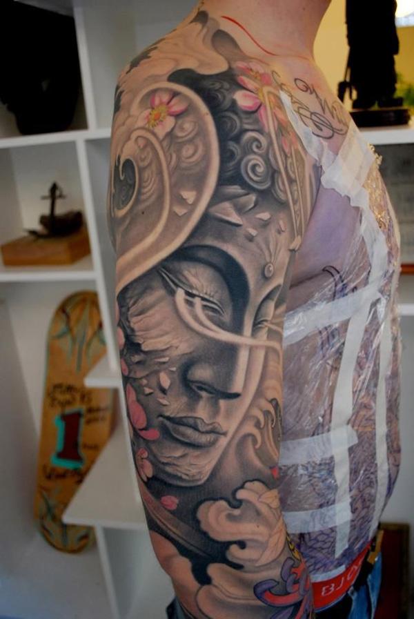 Get this surreal Buddha design for a full sleeve of masterpiece. The little delicate details such as the cracks and fragments makes the whole tattoo appear delicate and beautiful.