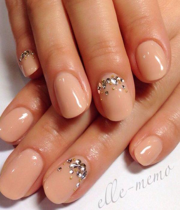 Glorious looking nude nail art with silver embellishments on top. Add embellishments to the cuticle part of the nails to give more effect to the nail art.