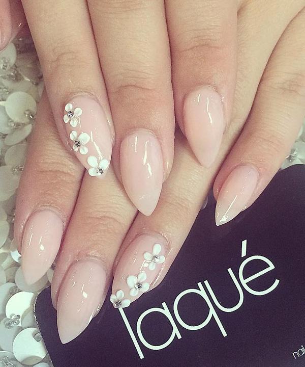 Pretty nude nail art design. A rather simple looking design that gives off a sophisticated aura, adding the tiny white flowers with silver beads on top just adds to its charm.