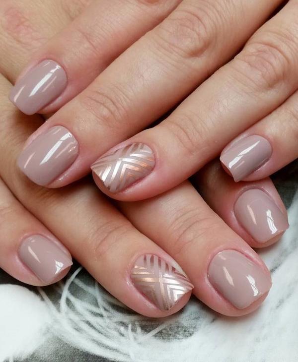 A combination of nude and platinum nail polish. In diagonal shapes, the metallic polish simply makes the nude nail polish stand out from behind.