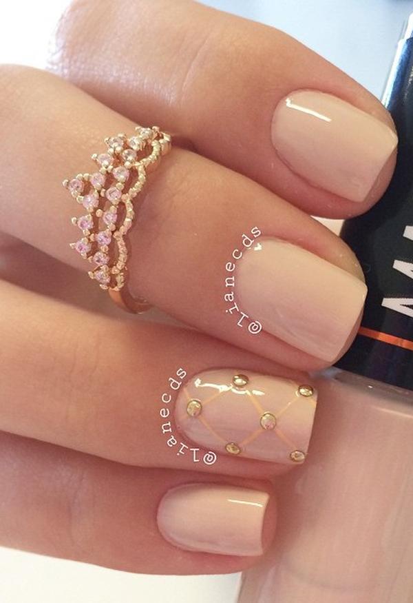 Another nude nail art design with gold beads on top. This design also has the single diagonal shaped mail which is prettily highlighted from the rest of the nails.