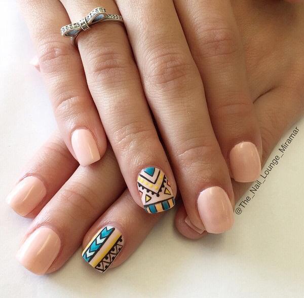 Tribal inspired nude nail art designs. This design proves that you should not be scared in using bold and bright colors together with your all nude nails.