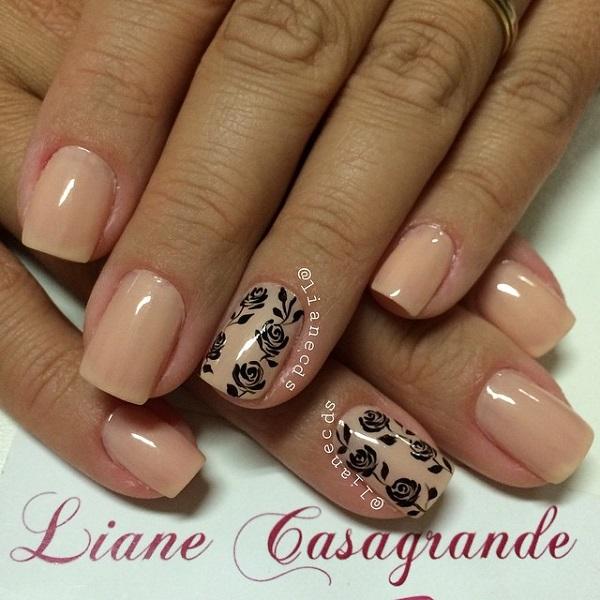 A very pretty nude nail art design with flower details on it. The flowers are painted in light strokes of black polish and they fit perfectly with the subtle color of nude as its base.