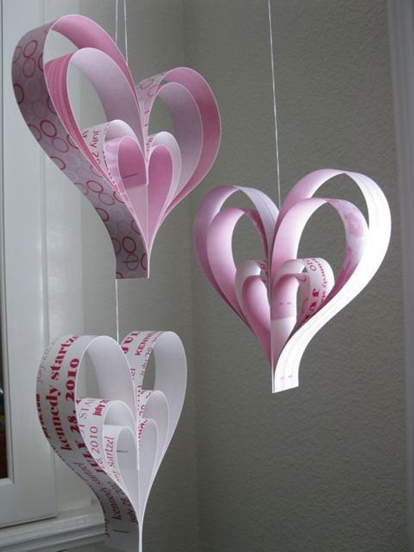 Create a heart chandelier made out of craft papers, magazines and strings.