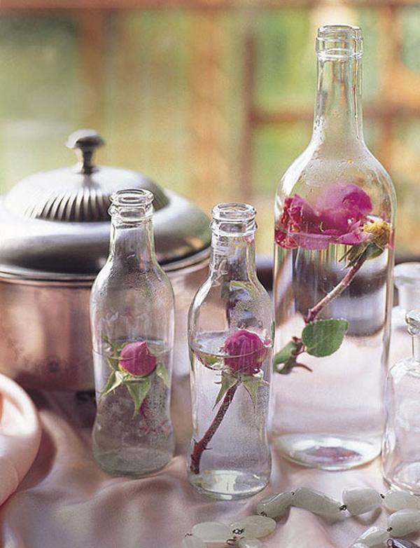 Fan of Beauty and the Beast? Pour water your glass bottles and carefully place a single stem of rose inside. Roses that are yet to bloom could make the picture much perfect.