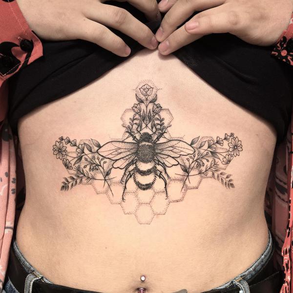 Bee and honeycomb underboob tattoo