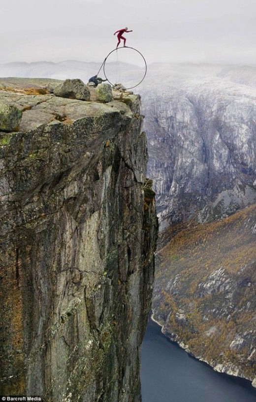 balance4-520x814 Photo of Stand on a single wheel at the edge of a cliff