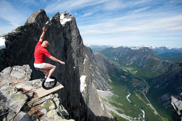art of balance  photo of bicycle show on the edge of a cliff