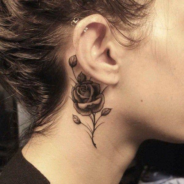 Black and grey rose tattoo behind ear