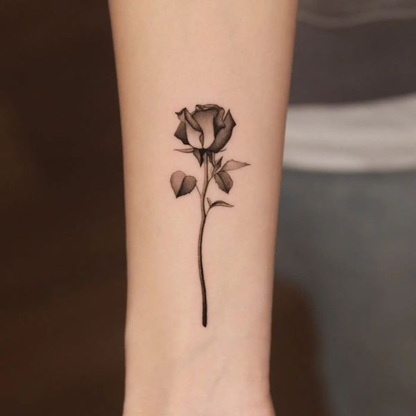 Black work rose tattoo