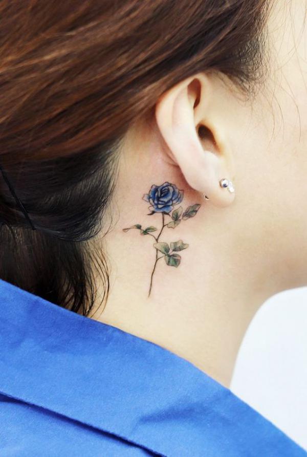 Blue rose tattoo behind ear