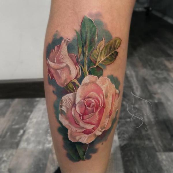 Lower leg pink rose tattoo