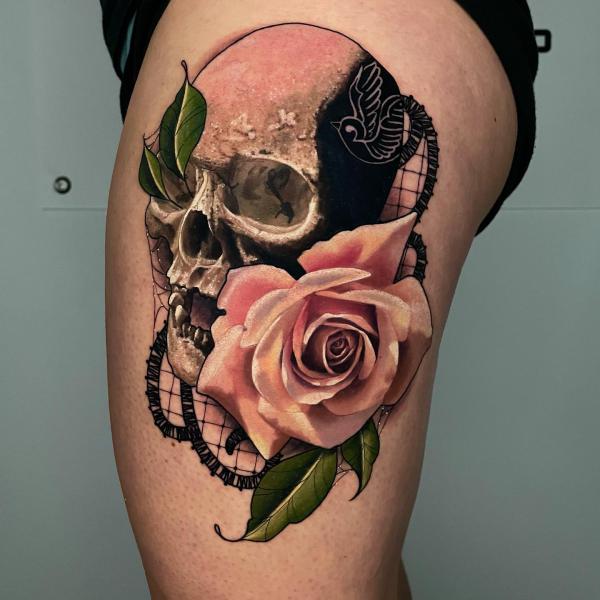 Pink rose and skull tattoo