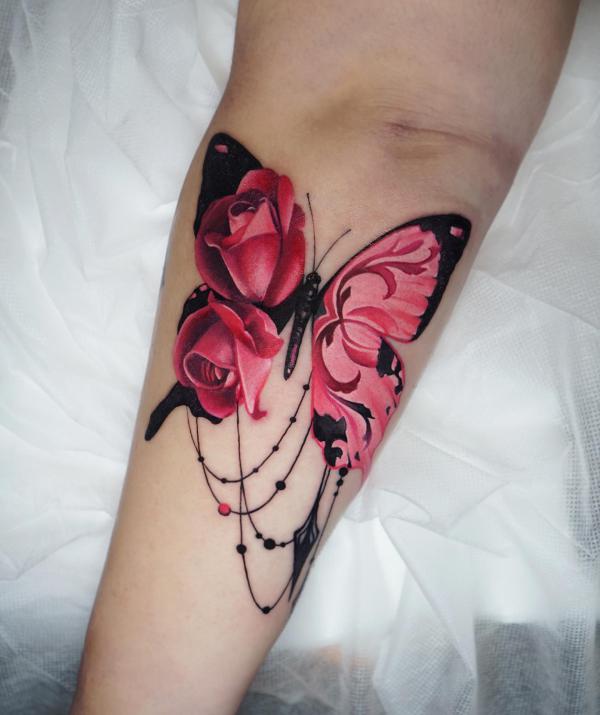 Pink rose butterfly tattoo