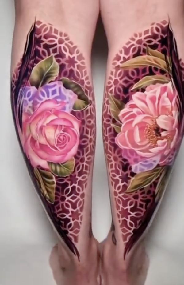 Pink rose on geometric backdrop calf tattoo