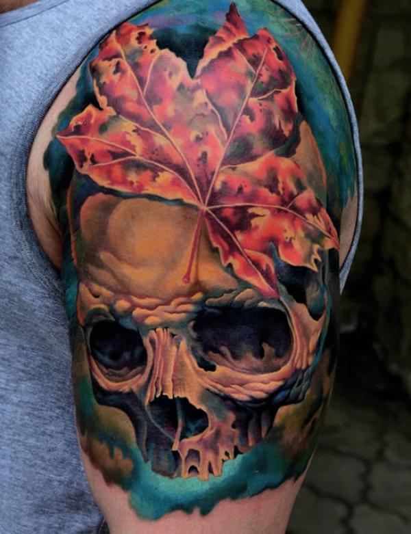 Green leaf and skull in dark sahde