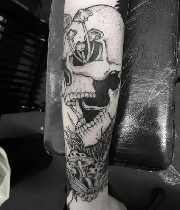 Black and grey skull and mushroom tattoo