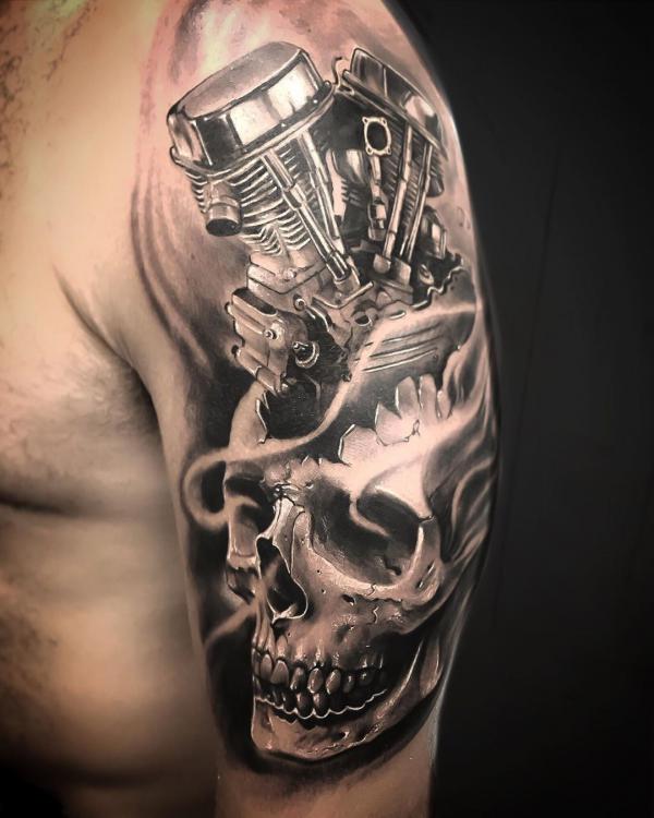 Realistic skull and engine tattoo half sleeve
