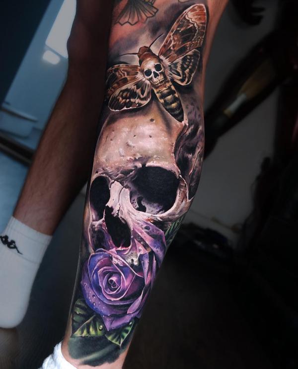 Realistic skull with purple rose and death moth