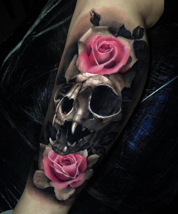 Calf tattoo with pink Roses and feline skull in black and grey style