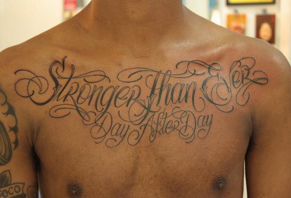 Temporary lettering tattoo on the chest