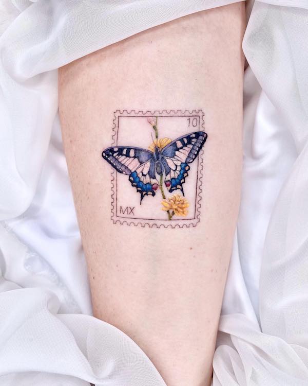 Small butterfly stamp tattoo for women