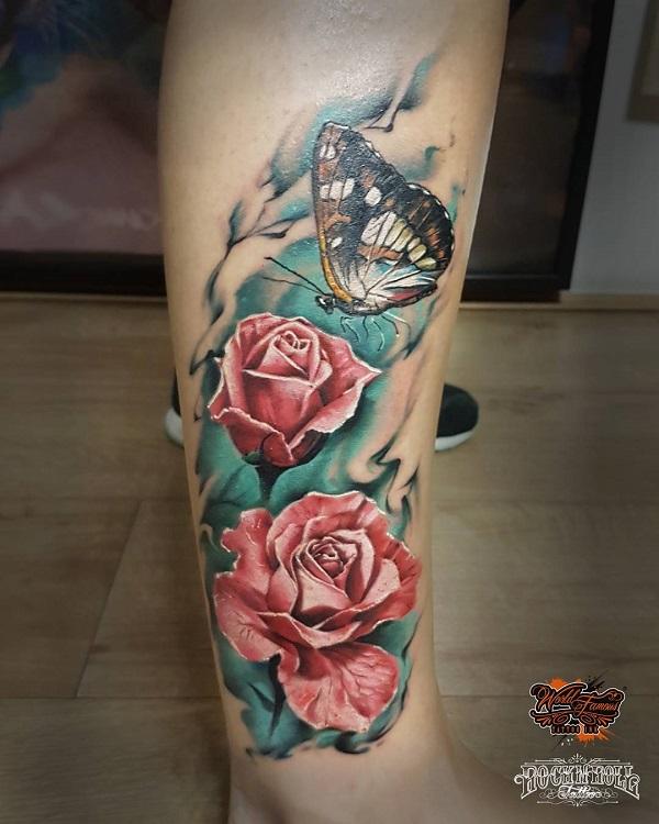 Butterfly and flower tattoos on leg