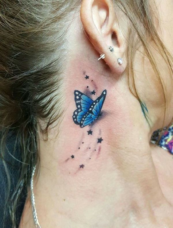 An ear tattoo of Realistic butterfly and star tassel 