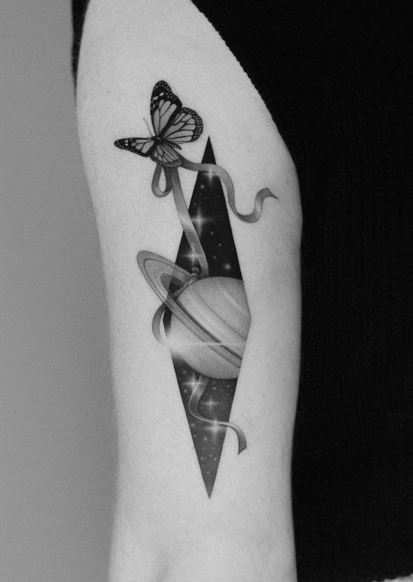 butterfly tattoo of Let a butterfly move the orbit of the planet 