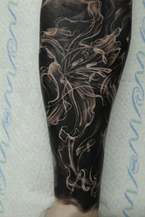 Abstract lily blackout tattoo