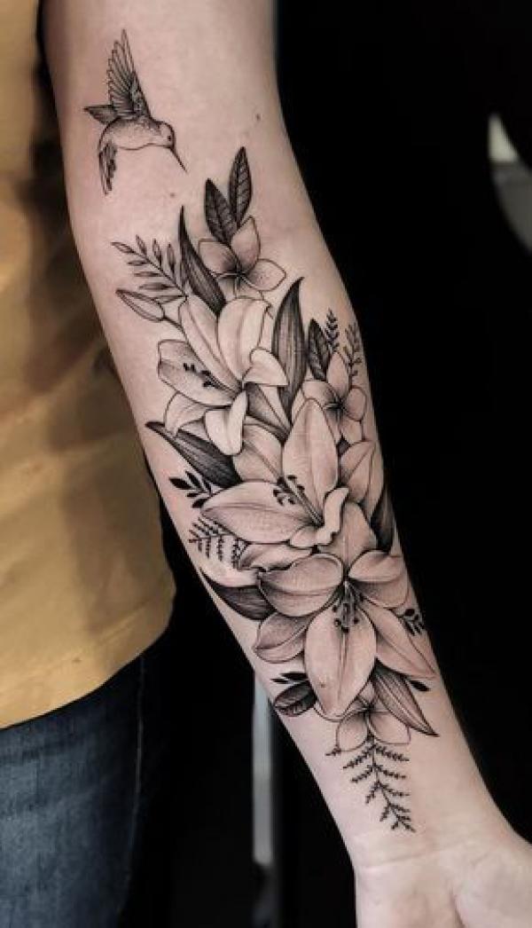 Black and grey lily and ferns with a hummingbird