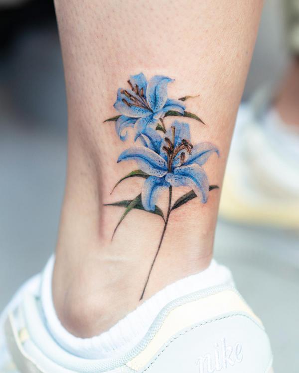 Blue tiger lily flower ankle tattoo