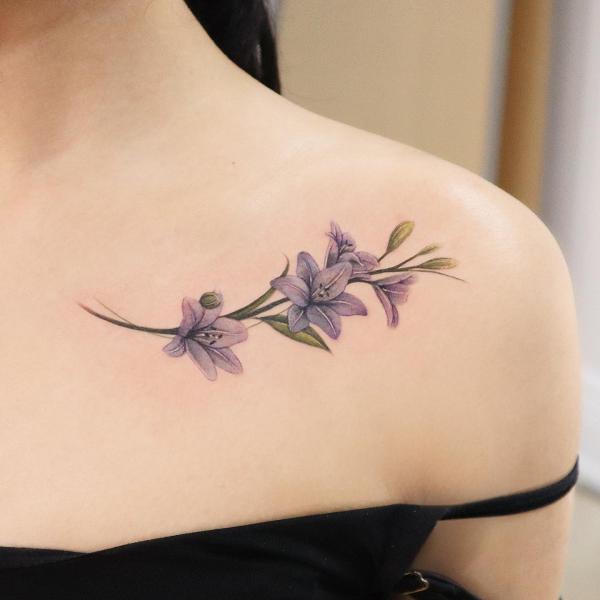 Cute lily collarbone tattoo