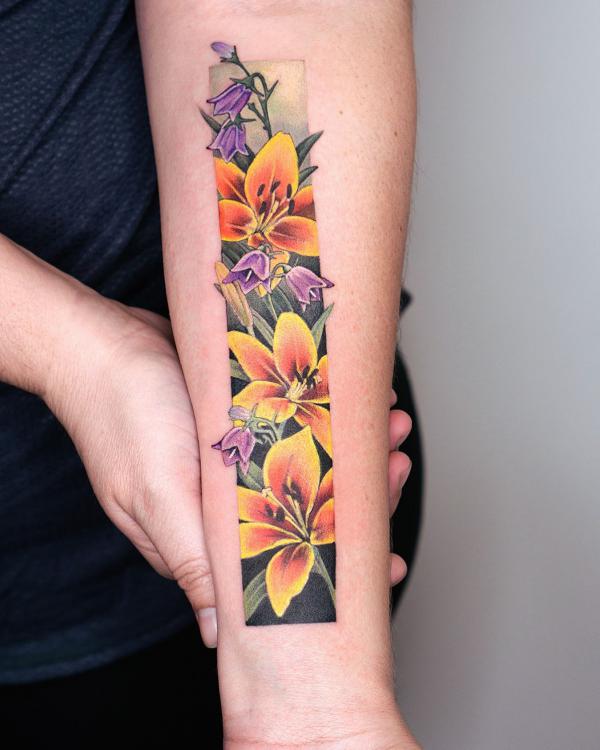 Yellow lily and purple lily of the valley rectangular tattoo