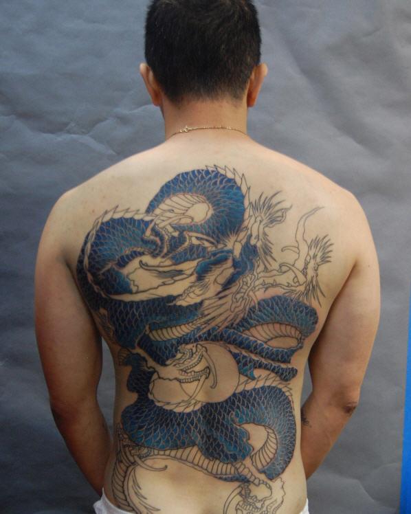 Realistic photo of a dragon tattoo on a man's arm