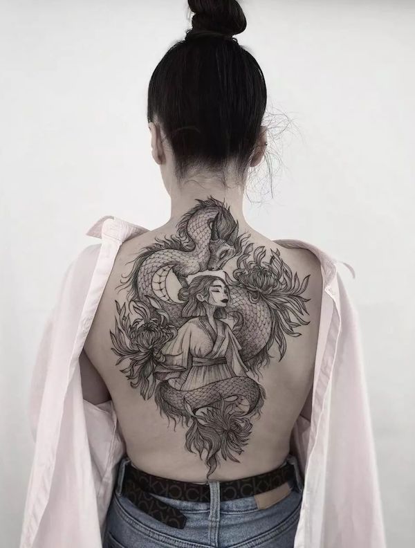 A fairy girl and a dragon adorned with flowers