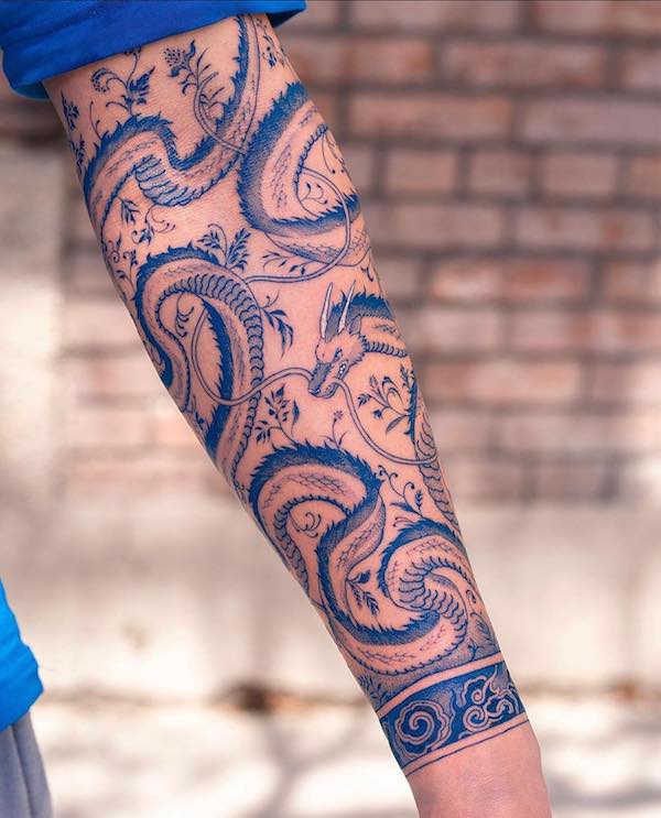 Blue dragon forearm tattoo