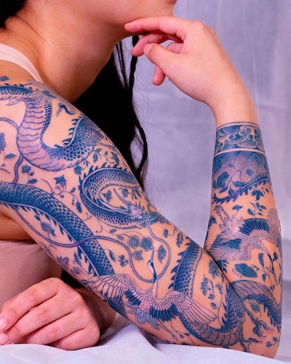 Blue dragon full sleeve tattoo for women