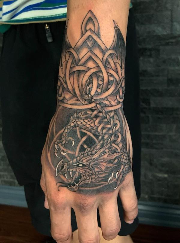 Celtic dragon hand tattoo