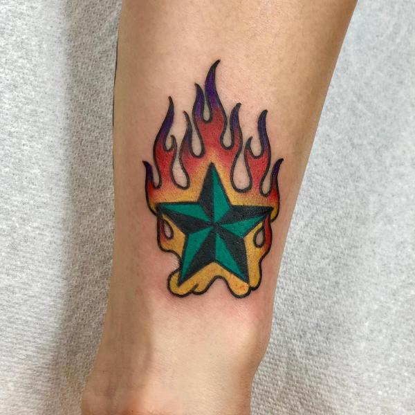 Flaming star tattoo